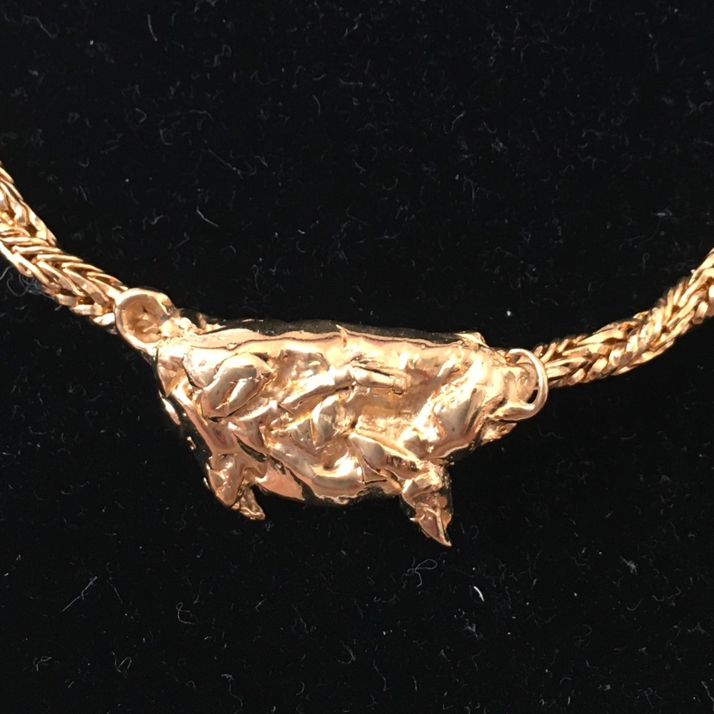Animal series necklaces.  Goldplated and signed. Boar